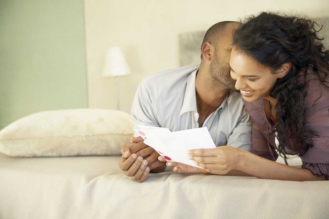 A couple reading a card