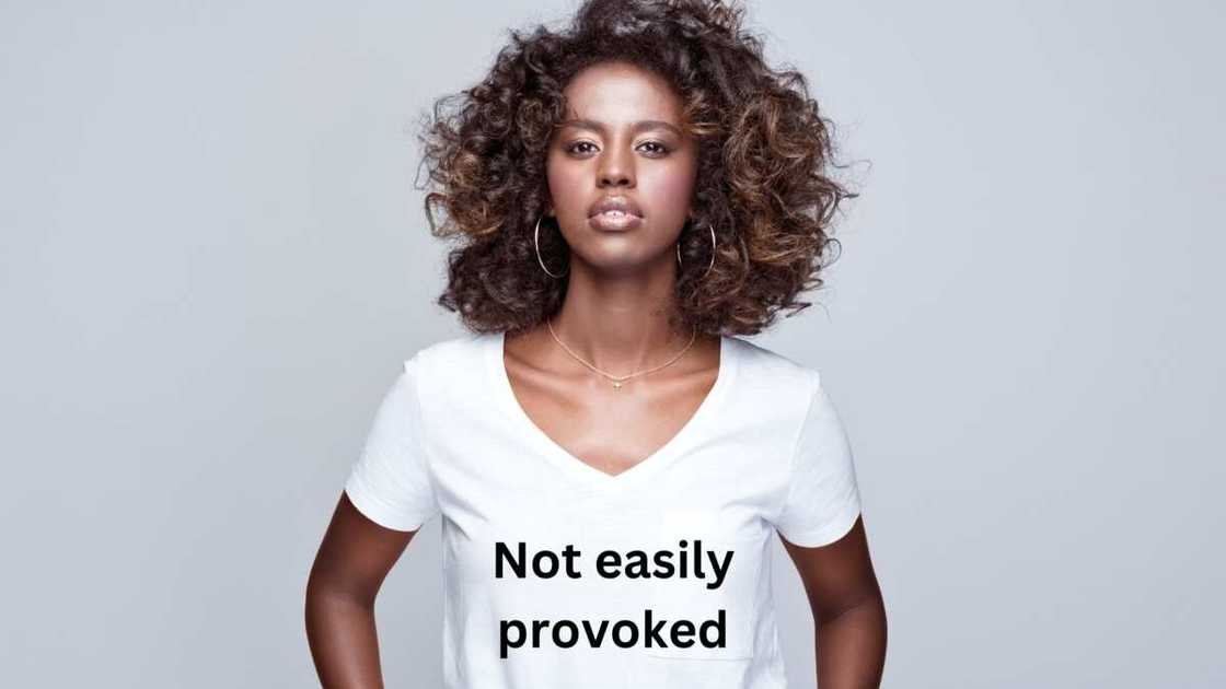 An African woman displays white lie shirt ideas An African woman displays white lie shirt ideas