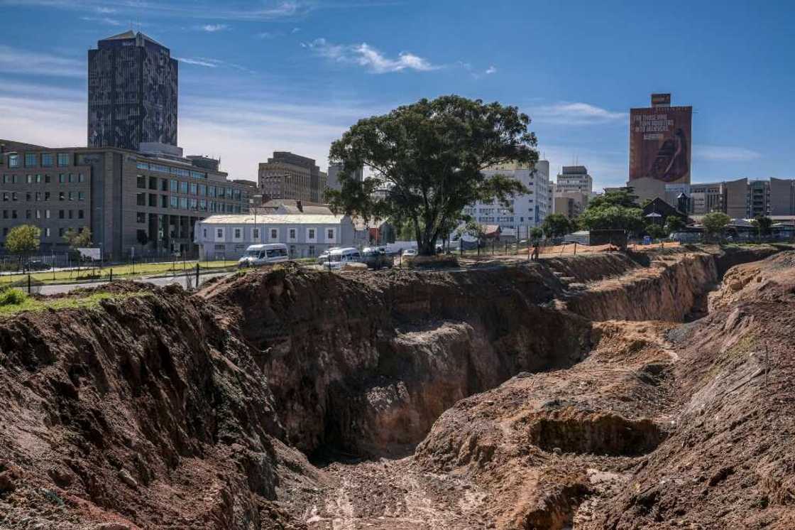 Dug out by hand and deepened with explosives, the gouge testifies to the gold rush that founded Johannesburg - and fuelled segregation and inequality