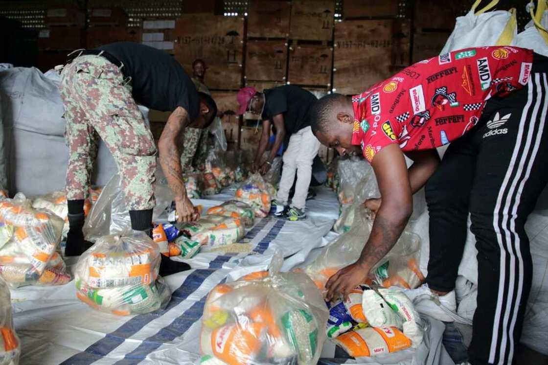 Soldiers pack food, part of 40,000 tons of goods donated by Venezuela, after heavy rainfall caused severe floods in Paramaribo, Suriname, on June 18, 2022 Soldiers pack food, part of 40,000 tons of goods donated by Venezuela, after heavy rainfall caused severe floods in Paramaribo, Suriname, on June 18, 2022