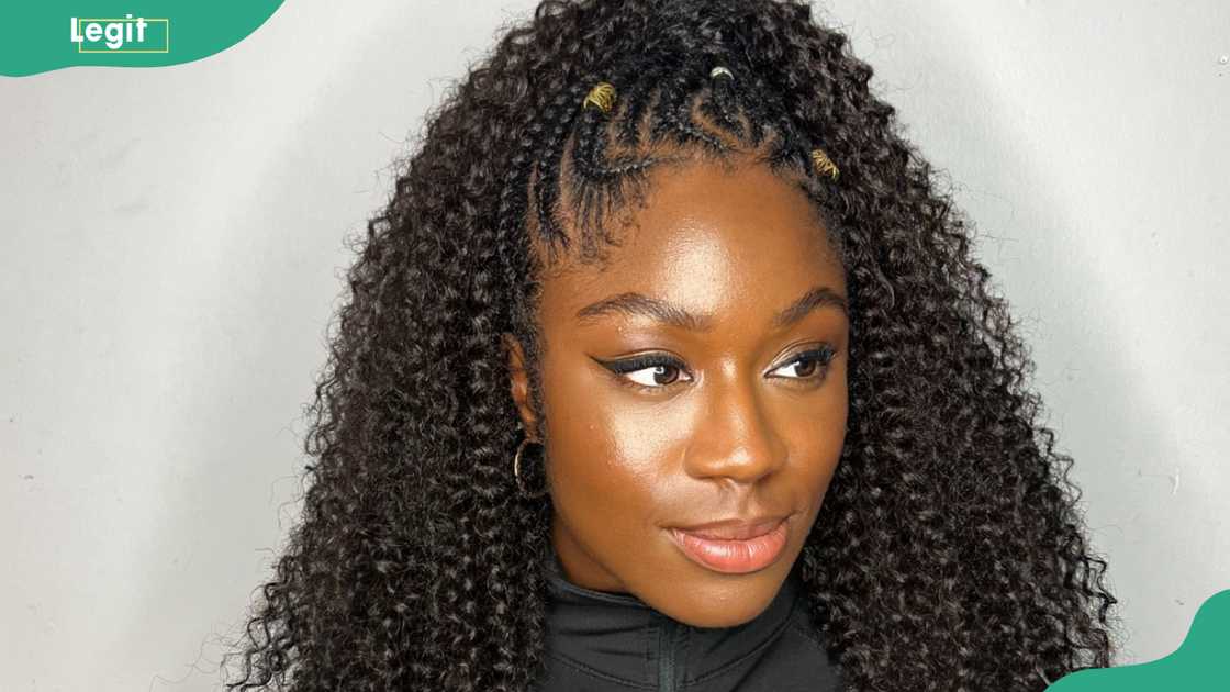 Lady wearing the cornrows and crochet hairstyle Lady wearing the cornrows and crochet hairstyle