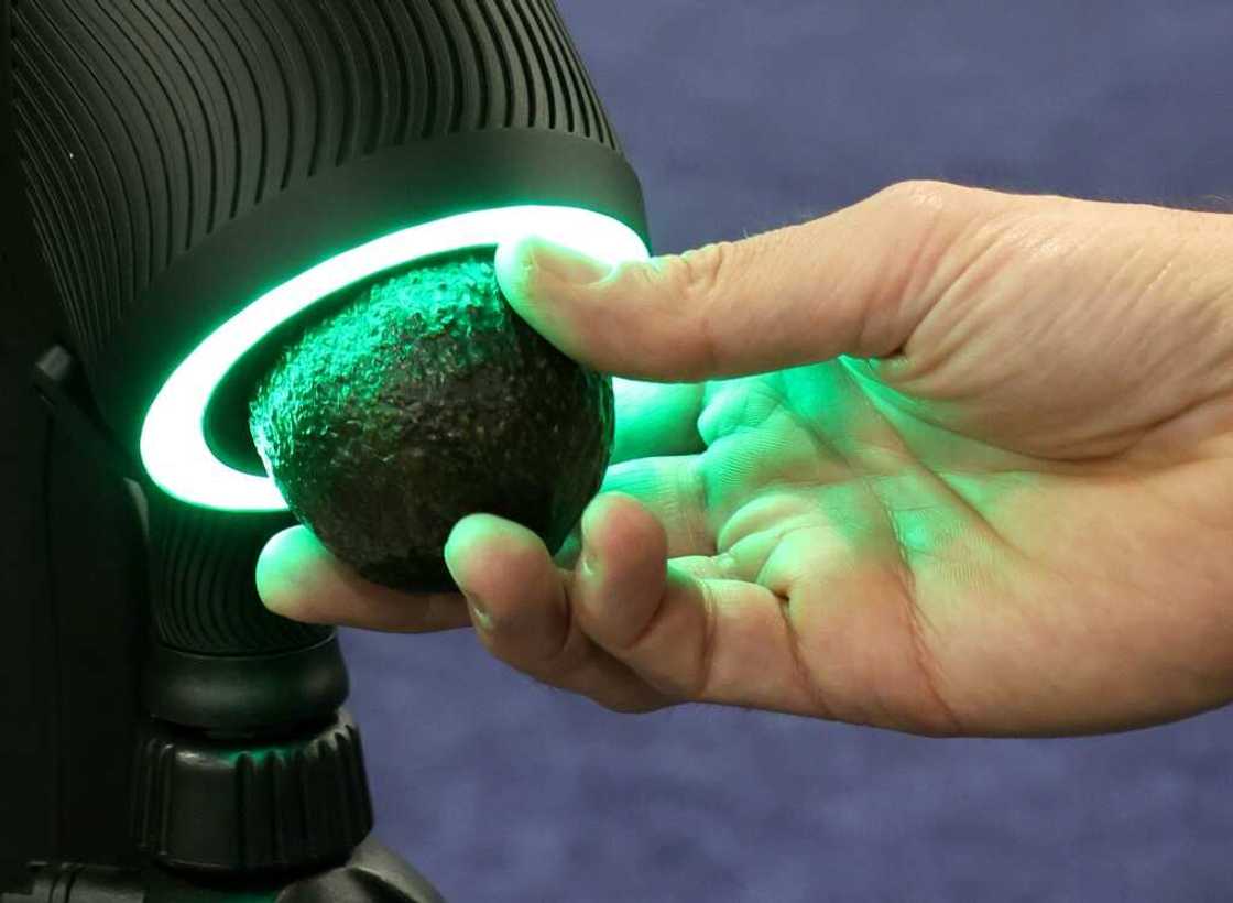 The OneThird Ripeness Checker is demonstrated checking an avocado during a press event at CES 2023 The OneThird Ripeness Checker is demonstrated checking an avocado during a press event at CES 2023