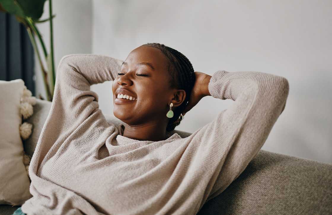 A young woman relaxing on the sofa at home