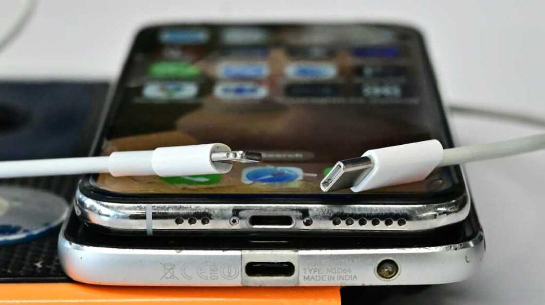 A USB-C charger (R) and a traditional Apple Lightning charger (L) are seen on an Apple iPhone A USB-C charger (R) and a traditional Apple Lightning charger (L) are seen on an Apple iPhone