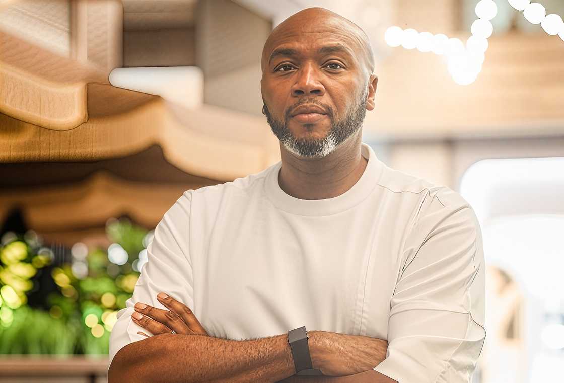 Jason Njoku wearing a white short-sleeved shirt and a black watch, poses with his arms crossed Jason Njoku wearing a white short-sleeved shirt and a black watch, poses with his arms crossed