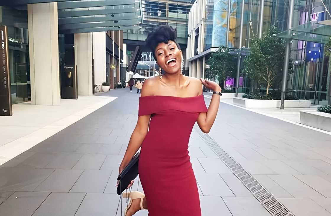 A lady in red posing in a street in Australia