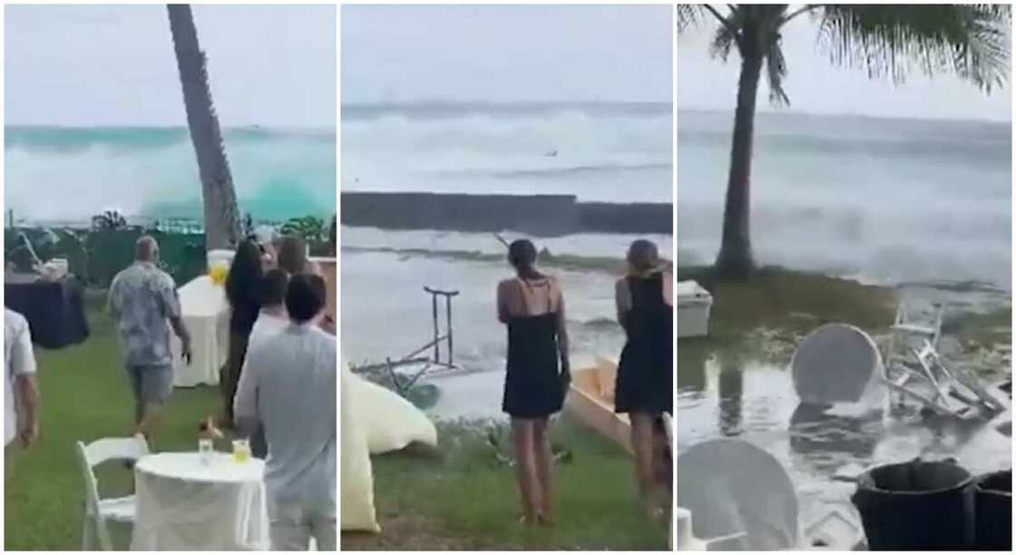 Photos show wedding guests standing close to a water body as it spills over. Photos show wedding guests standing close to a water body as it spills over.