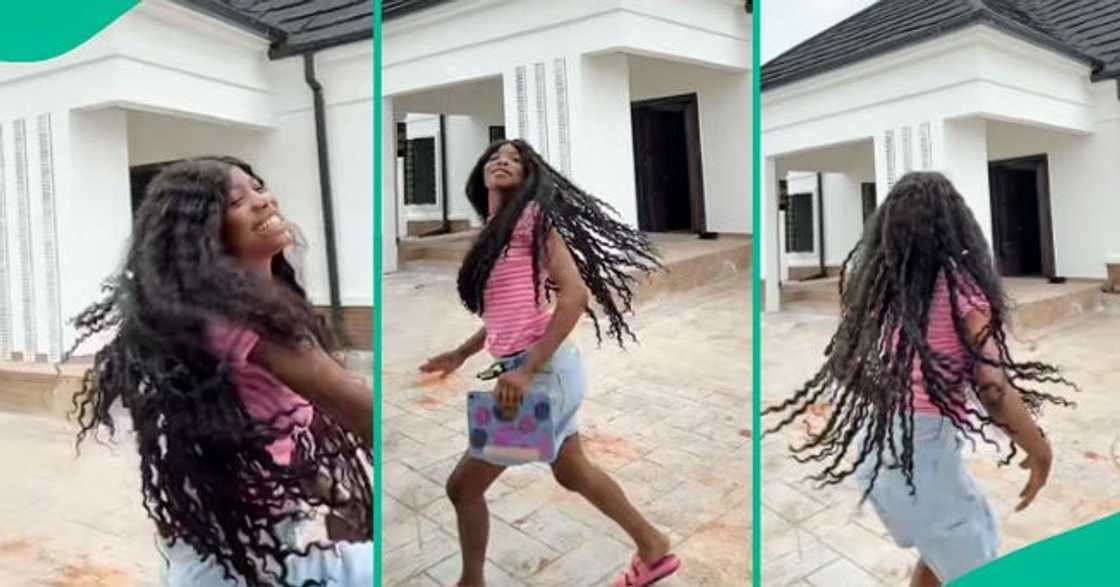 Nigerian lady shows off her new bungalow. Nigerian lady shows off her new bungalow.