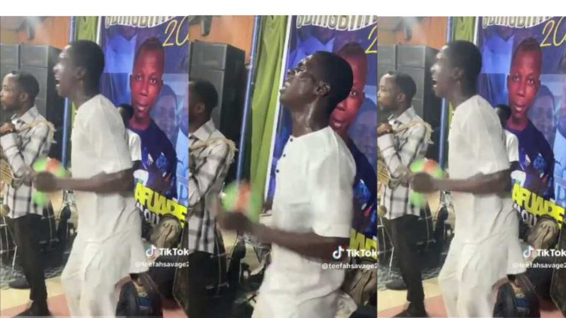 Man plays shekere, almost lose it out of excitement