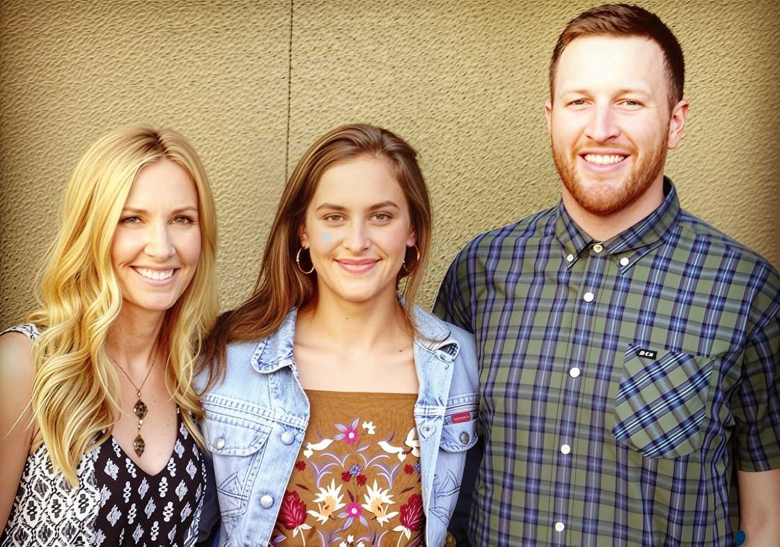 Miah Harbaugh poses standing with Grace Harbaugh and Jay Harbaugh.