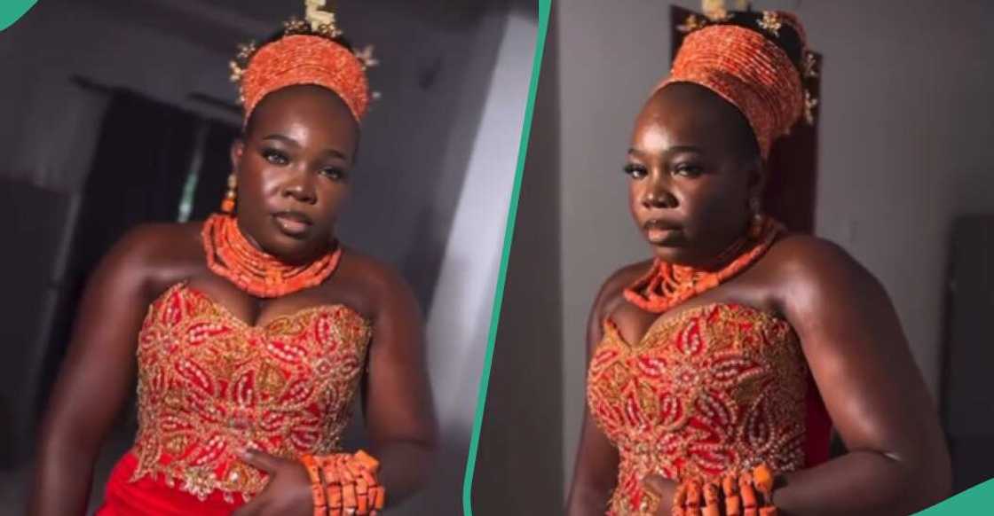Lady adorns tight Edo attire Lady adorns tight Edo attire