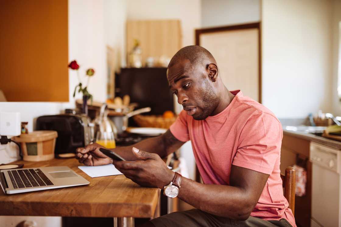 A man checks an email he has received