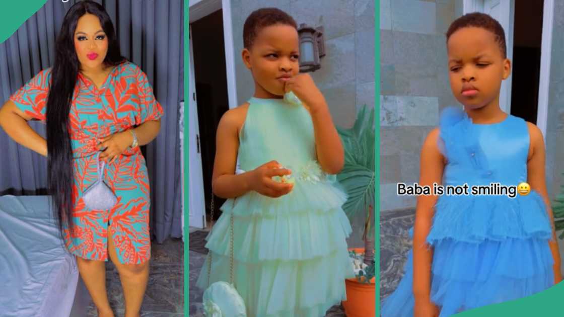 Video as young boy models his mum's business outfits, wears female dresses