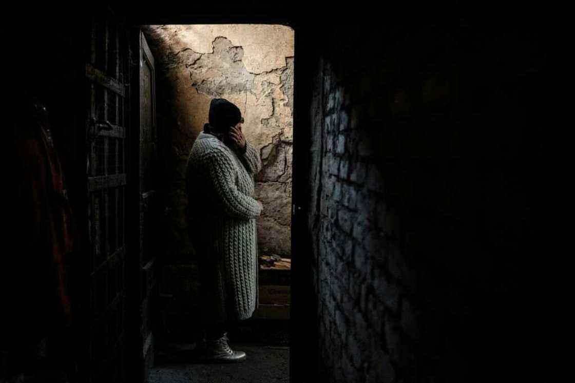 Hanna leaves her basement shelter, where she has lived since May 2022, in the recently retaken town of Lyman in Donetsk region