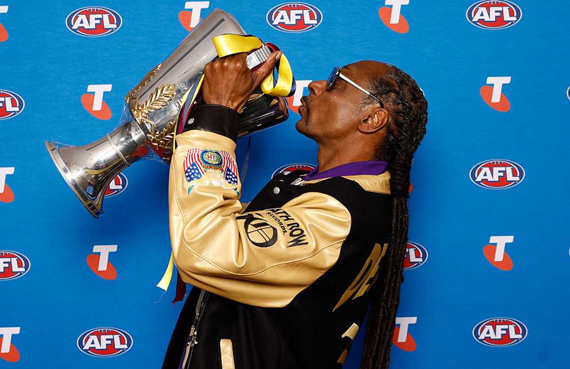 Snoop Dogg poses with the Premiership Cup