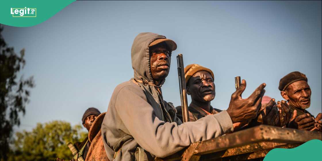 Nigerian vigilante officers holding locallymade guns Nigerian vigilante officers holding locallymade guns