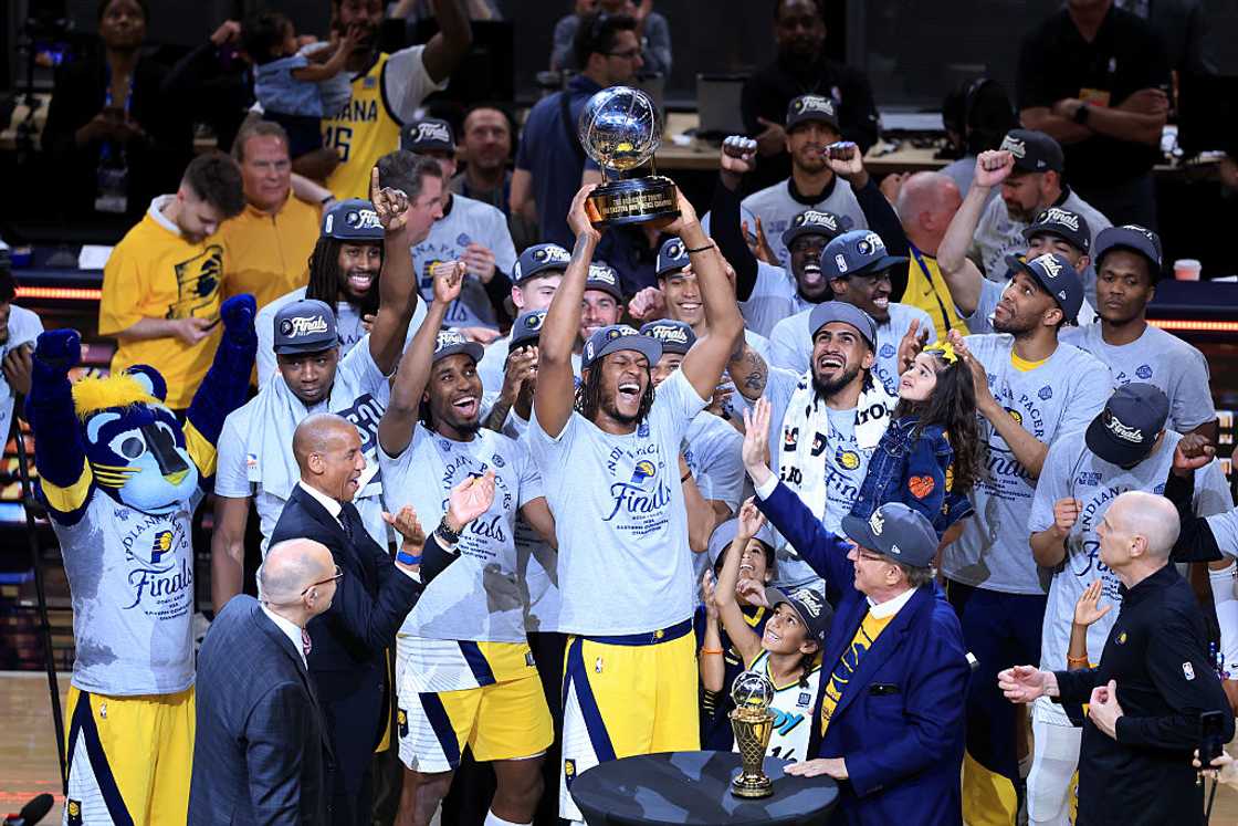 Myles Turner of the Indiana Pacers celebrates with the Bob Cousy Trophy after the 125-108 win against the New York Knicks at Gainbridge Fieldhouse in Indianapolis, Indiana Myles Turner of the Indiana Pacers celebrates with the Bob Cousy Trophy after the 125-108 win against the New York Knicks at Gainbridge Fieldhouse in Indianapolis, Indiana