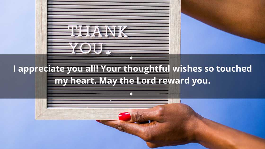 A person's hand holding a board written thank you A person's hand holding a board written thank you