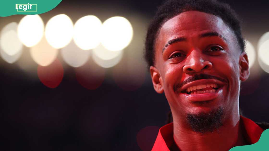 Close-up of Ja Morant smiling at the camera in a red Portland Trail Blazers warm-up top before a game at Moda Center, 2026 Close-up of Ja Morant smiling at the camera in a red Portland Trail Blazers warm-up top before a game at Moda Center, 2026