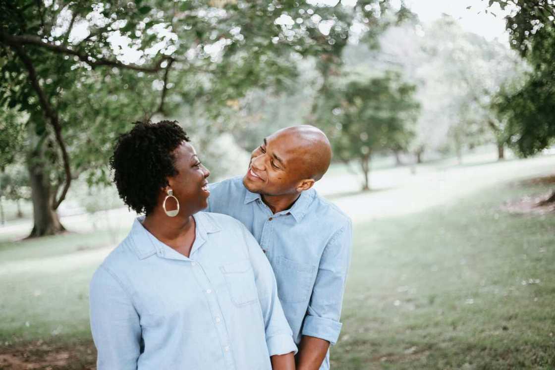 A man and woman holding each other