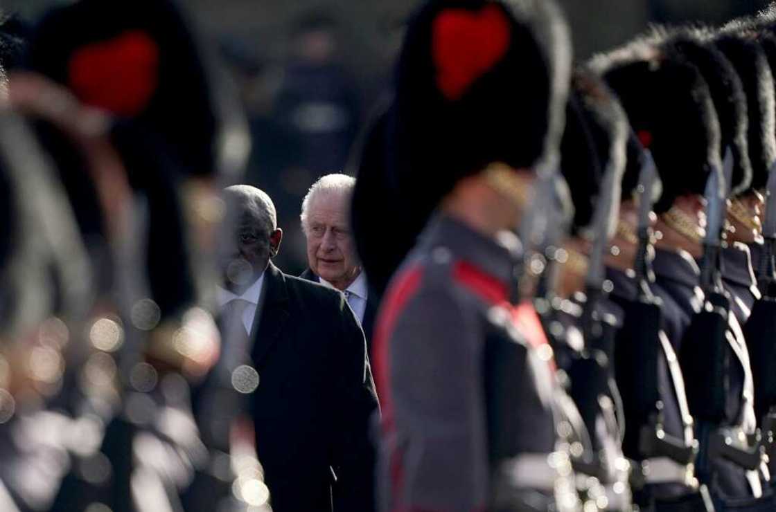 Ramaphosa and Charles inspect a Guard of Honour