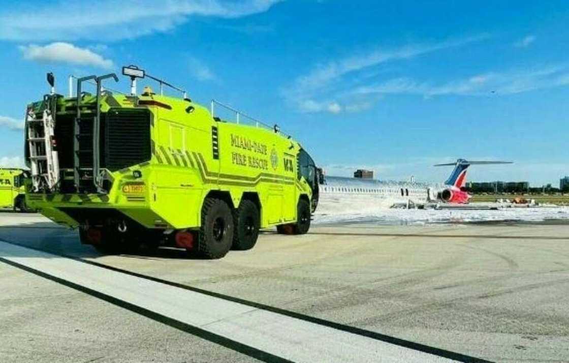 A Red Air jet is seen after catching fire while landing at Miami International Airport on June 22, 2022 A Red Air jet is seen after catching fire while landing at Miami International Airport on June 22, 2022