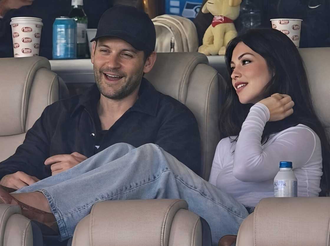Tobey Maguire sits with Mishka Silva