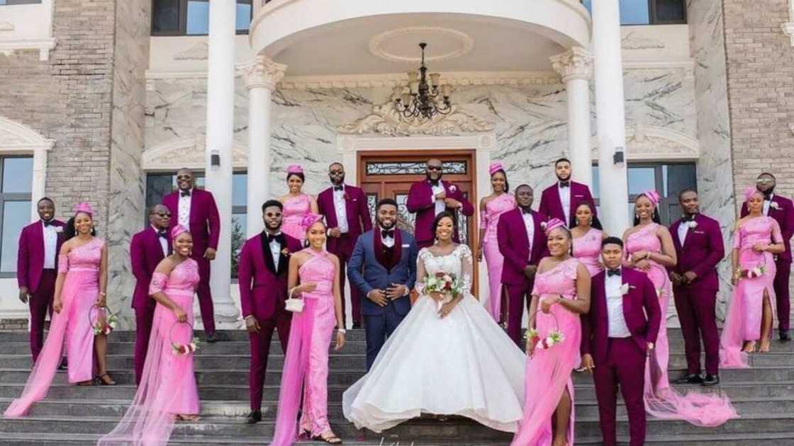 Adorable wedding photo lights up social media as couple and men in suits with bridal train showcase beauty Adorable wedding photo lights up social media as couple and men in suits with bridal train showcase beauty