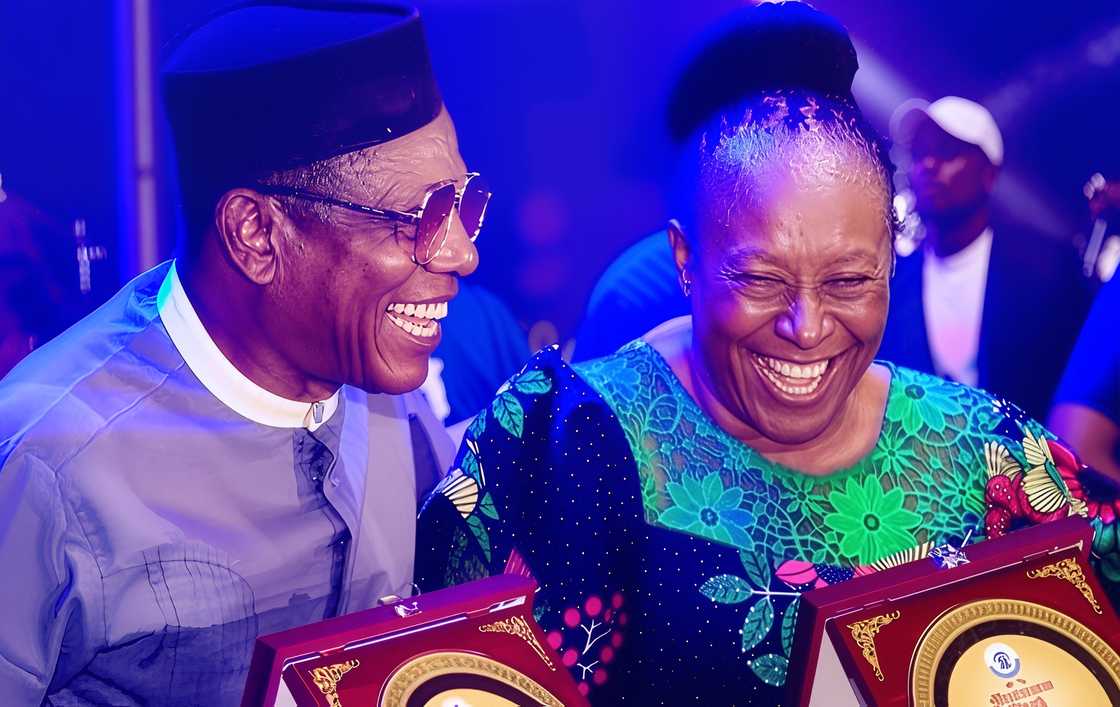Nkem Owoh and Patience Ozokwo laugh together during an awards ceremony. Nkem Owoh and Patience Ozokwo laugh together during an awards ceremony.