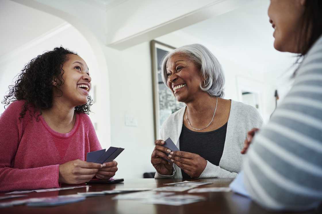 Happy ladies playing card games