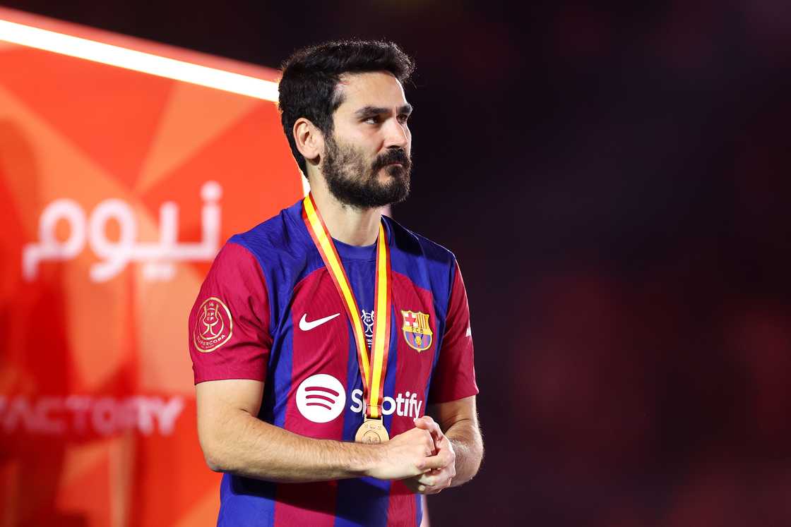 Ilkay Gundogan of FC Barcelona looks dejected with his runners-up medal after the team's defeat in the Super Copa de España Final match between Real Madrid and FC Barcelona in Riyadh Ilkay Gundogan of FC Barcelona looks dejected with his runners-up medal after the team's defeat in the Super Copa de España Final match between Real Madrid and FC Barcelona in Riyadh