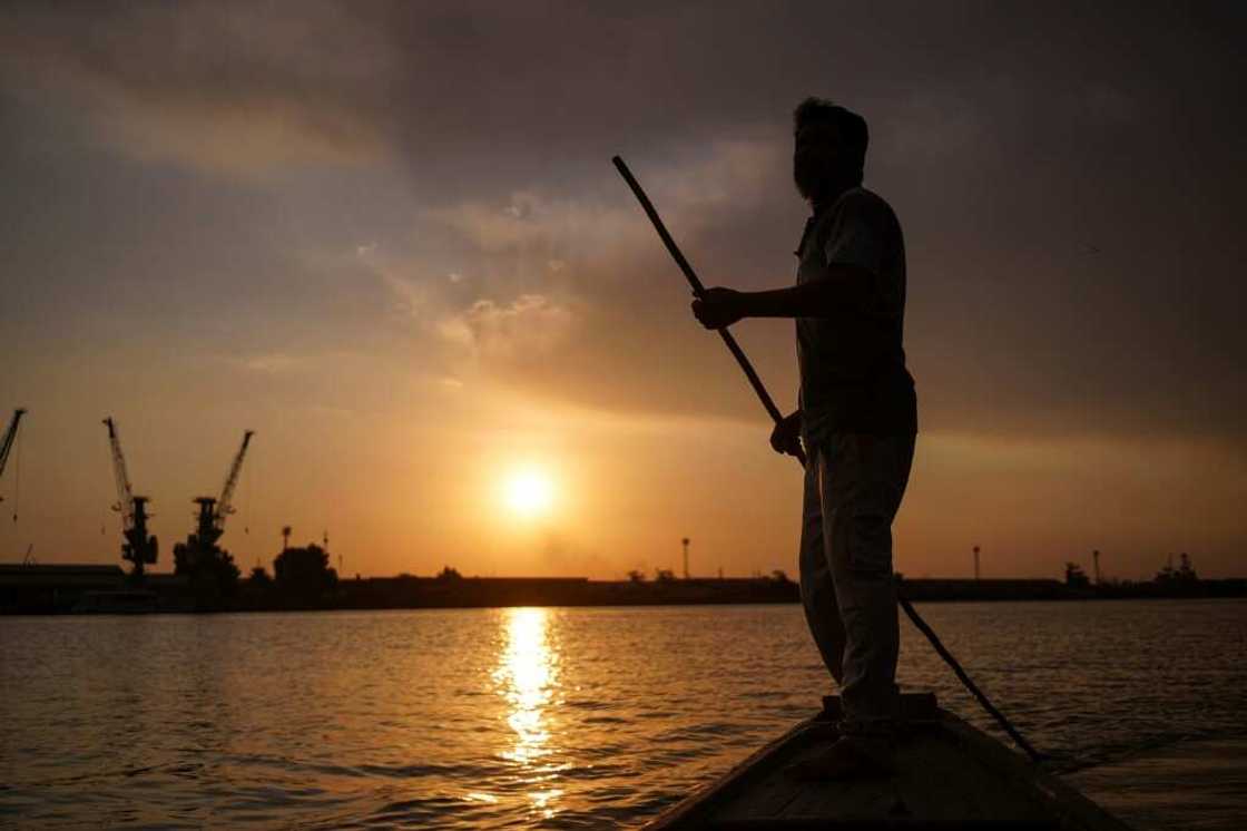 Sun setting on the Tigris: Iraqi fisherman Naim Haddad plys the Shatt al-Arab near Basra Sun setting on the Tigris: Iraqi fisherman Naim Haddad plys the Shatt al-Arab near Basra