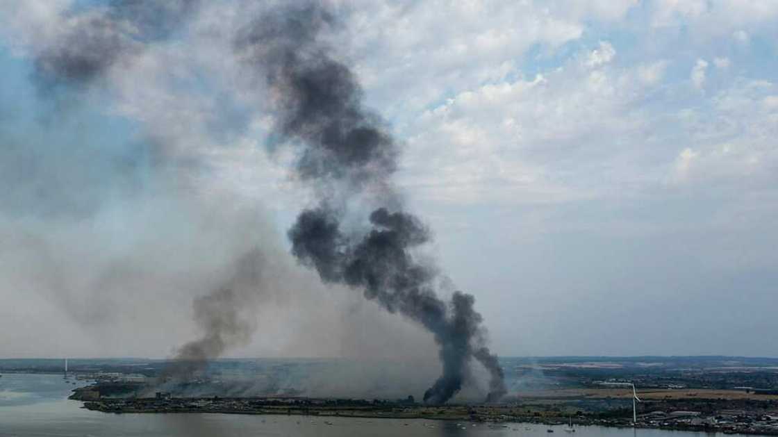 Dozens of wildfires broke out across England on Tuesday due to a fierce heatwave that pushed temperatures to record levels Dozens of wildfires broke out across England on Tuesday due to a fierce heatwave that pushed temperatures to record levels