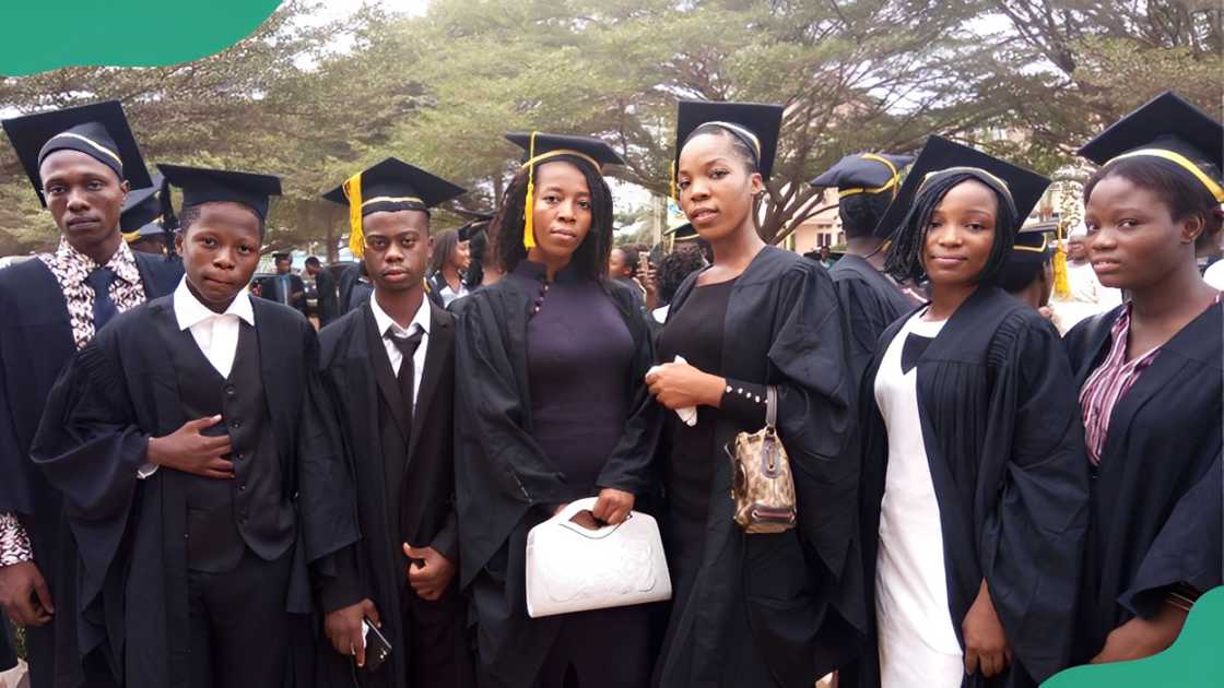 Crawford University students in black graduation gowns.
