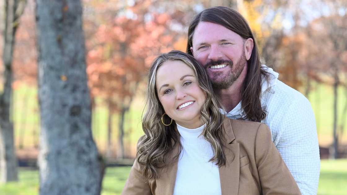 AJ Styles (L) poses with his wife Wendy (R) in a garden. AJ Styles (L) poses with his wife Wendy (R) in a garden.