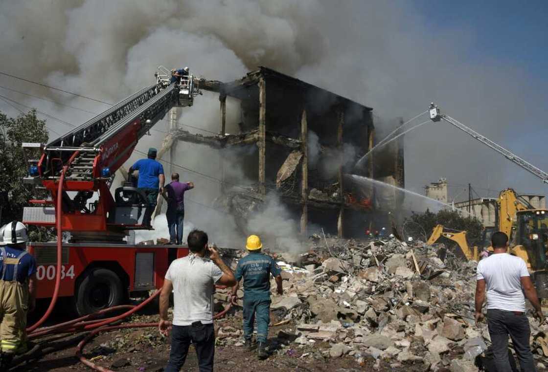 People are still believed to be trapped under rubble People are still believed to be trapped under rubble