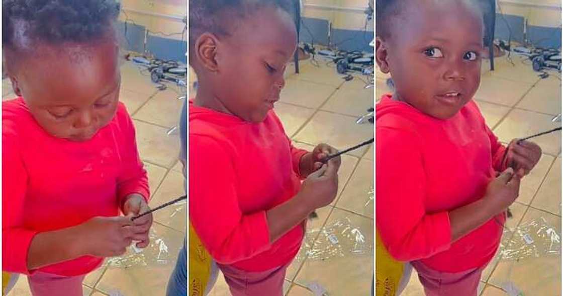 Little girl braids hair, four-year-old, adult Little girl braids hair, four-year-old, adult