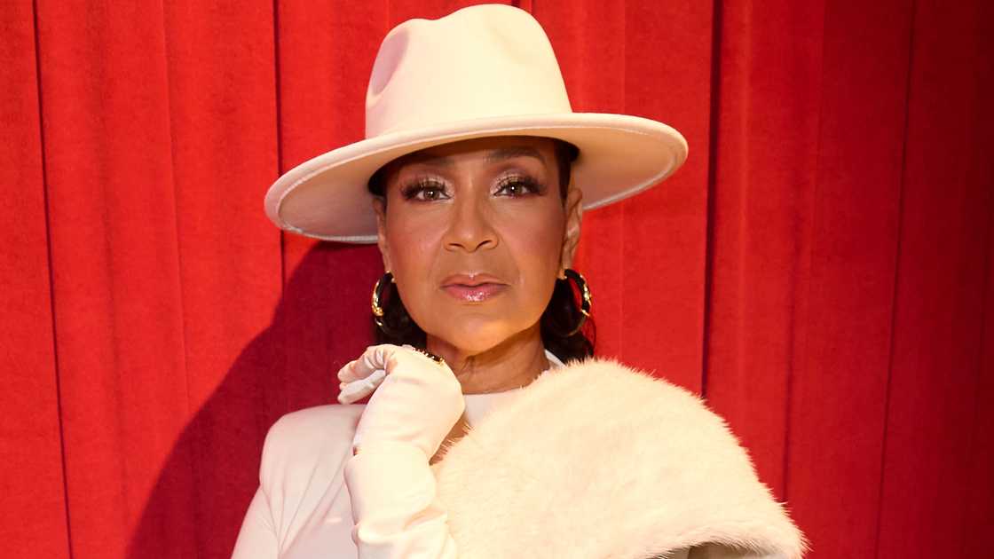 LisaRaye McCoy-Misick poses on the red carpet of the LA premiere of Fighting To Be Me: The Dwen Curry Story