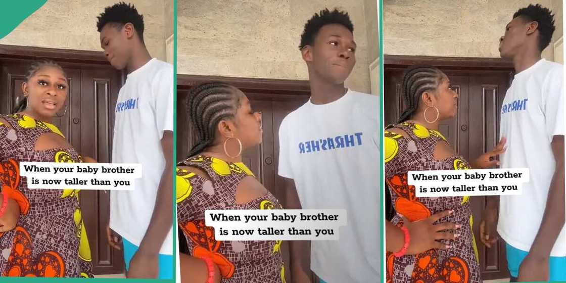 Lady shows younger brother who is taller than her.