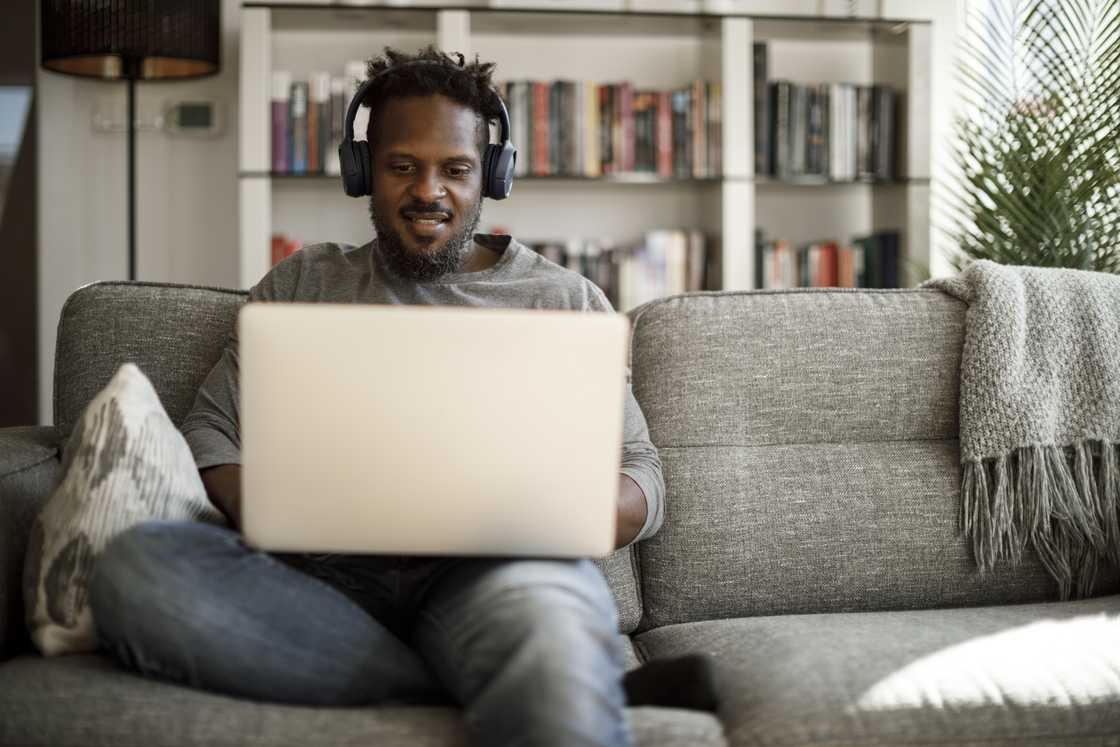 A young man using his laptop