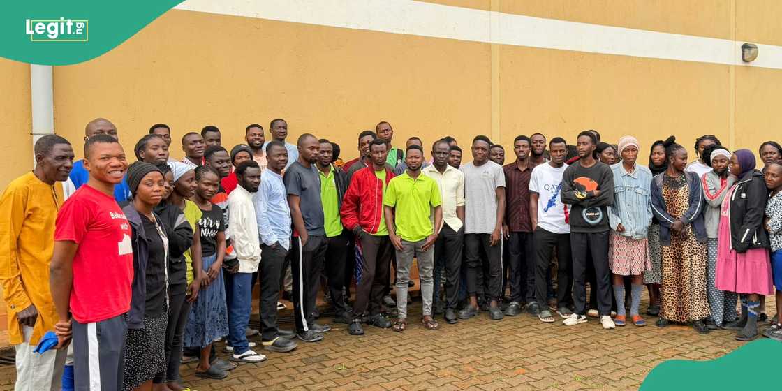 Authorities processed detained migrants following a crackdown on illegal work activities.