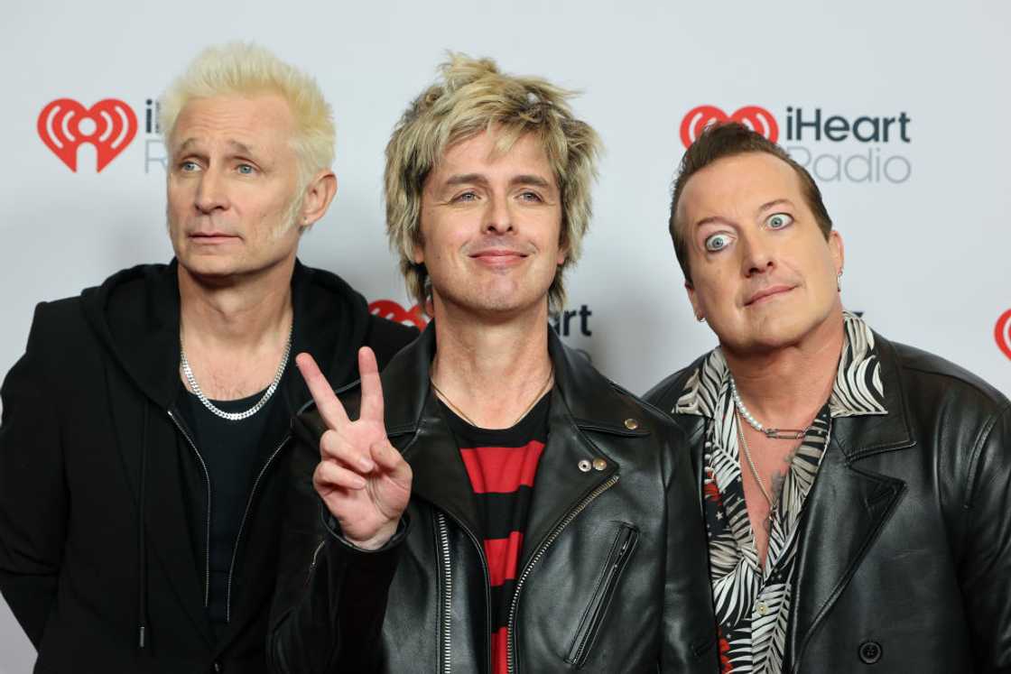 Mike Dirnt, Billie Joe Armstrong, and Tré Cool of Green Day at an award ceremony in California Mike Dirnt, Billie Joe Armstrong, and Tré Cool of Green Day at an award ceremony in California