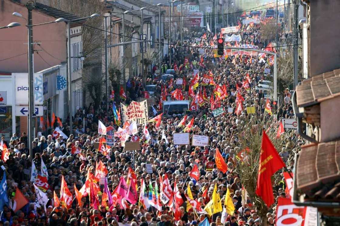 The ceremony at the Elysee palace happened on a day of massive anti-government protests