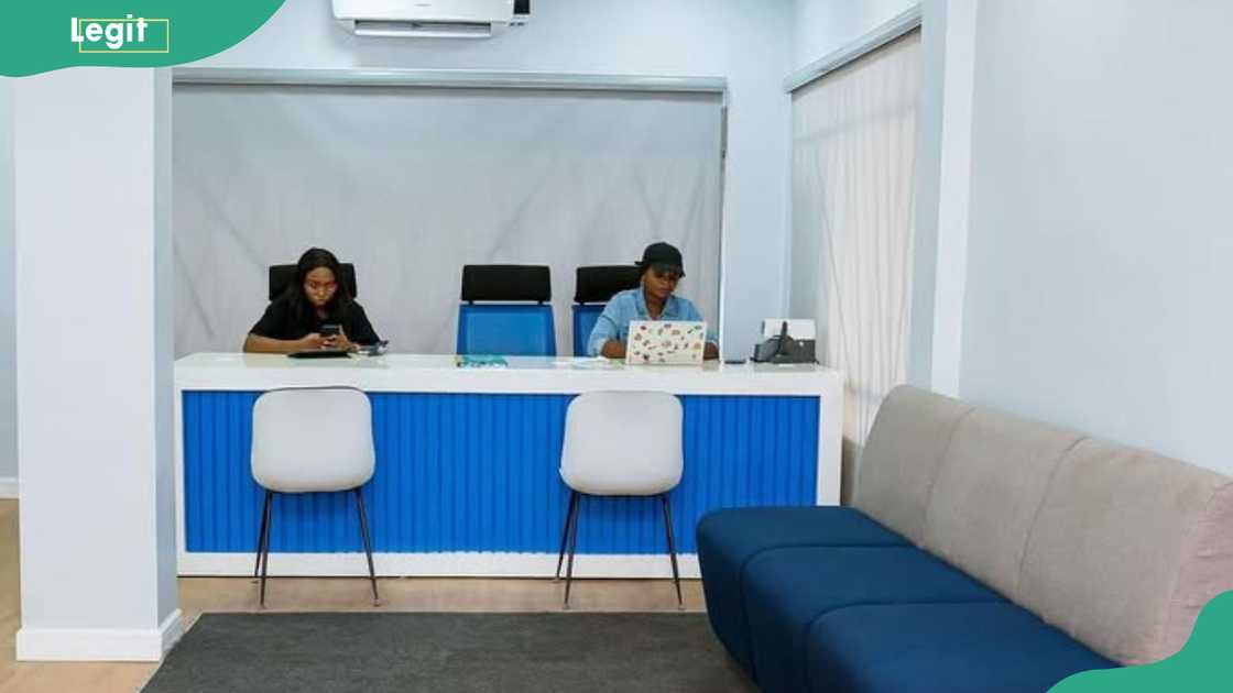 Two customer care attendants at a Moniepoint office Two customer care attendants at a Moniepoint office