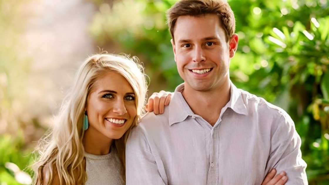 Katie Collinsworth and her husband, Patrick Hughes pose standing.