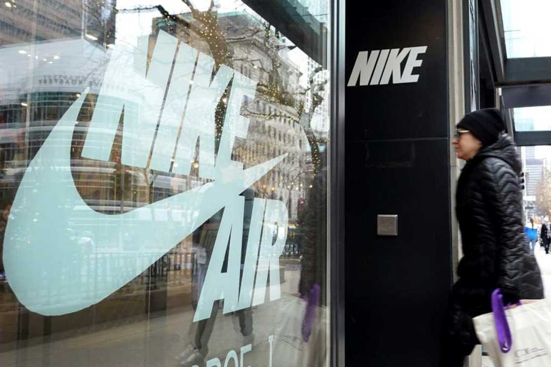 Nike shares fell after the sports giant reported lower profits Nike shares fell after the sports giant reported lower profits