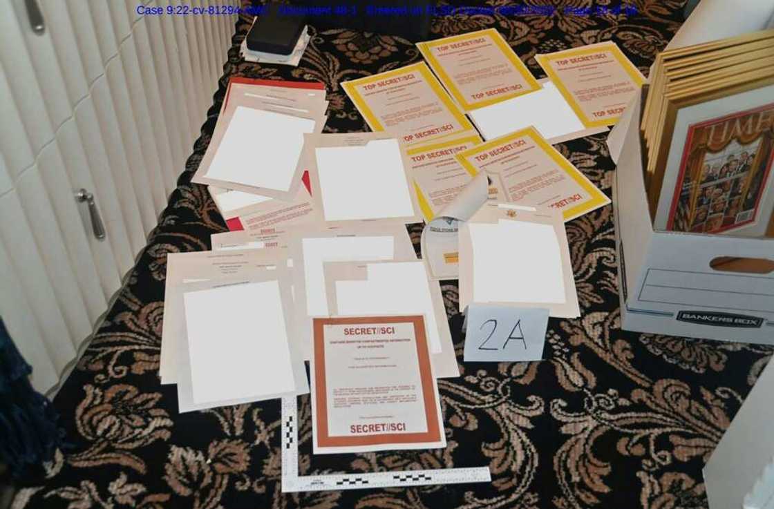 An undated photo released by the US Department of Justice on August 31, 2022 shows documents allegedly seized at Mar-a-Lago spread over a carpet An undated photo released by the US Department of Justice on August 31, 2022 shows documents allegedly seized at Mar-a-Lago spread over a carpet