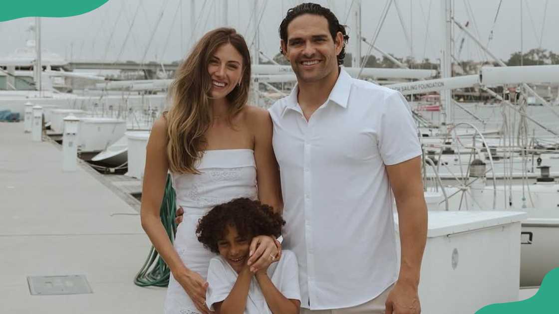 Perry Mattfeld, Mark Sanchez, and his son, Daniel, at a beach Perry Mattfeld, Mark Sanchez, and his son, Daniel, at a beach