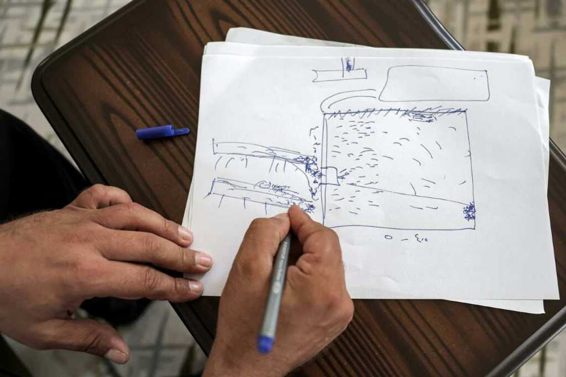 Moatassem Abdel Sater draws a rudimentary sketch of the prison plan Moatassem Abdel Sater draws a rudimentary sketch of the prison plan