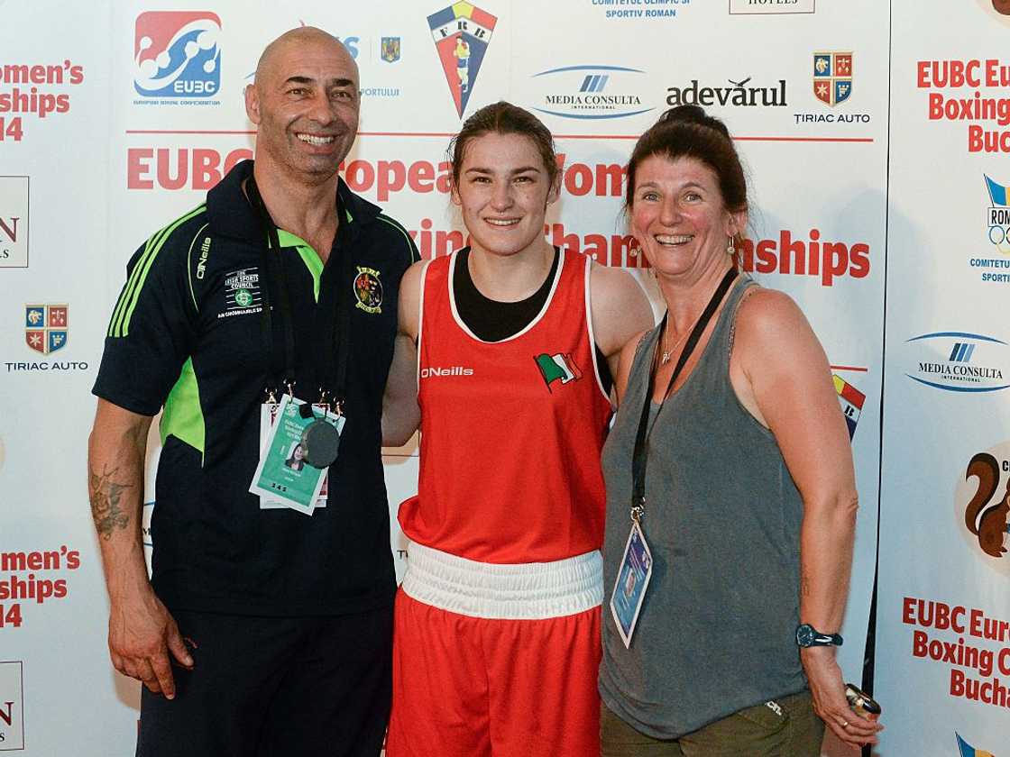 Katie Taylor with her parents, Pete Taylor, trainer, and mother Bridget. Katie Taylor with her parents, Pete Taylor, trainer, and mother Bridget.